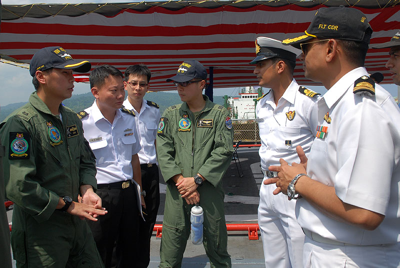 RSN and Indian Navy sailors interacting with each other during a cross-deck 