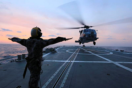 MH-60R landing onbard aircraft carrier